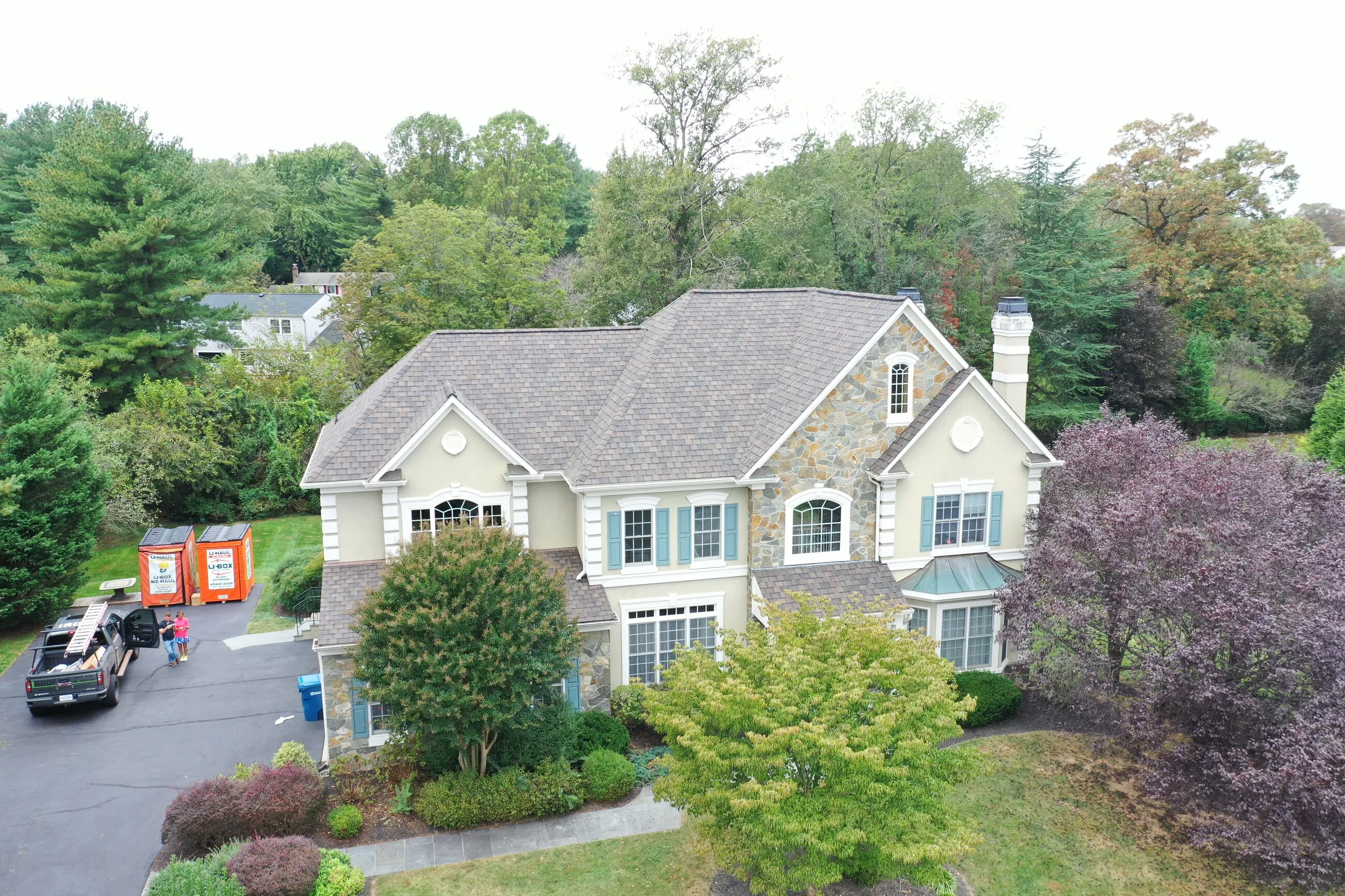 Aerial view of a completed designer shingle roof in a brownstone blend