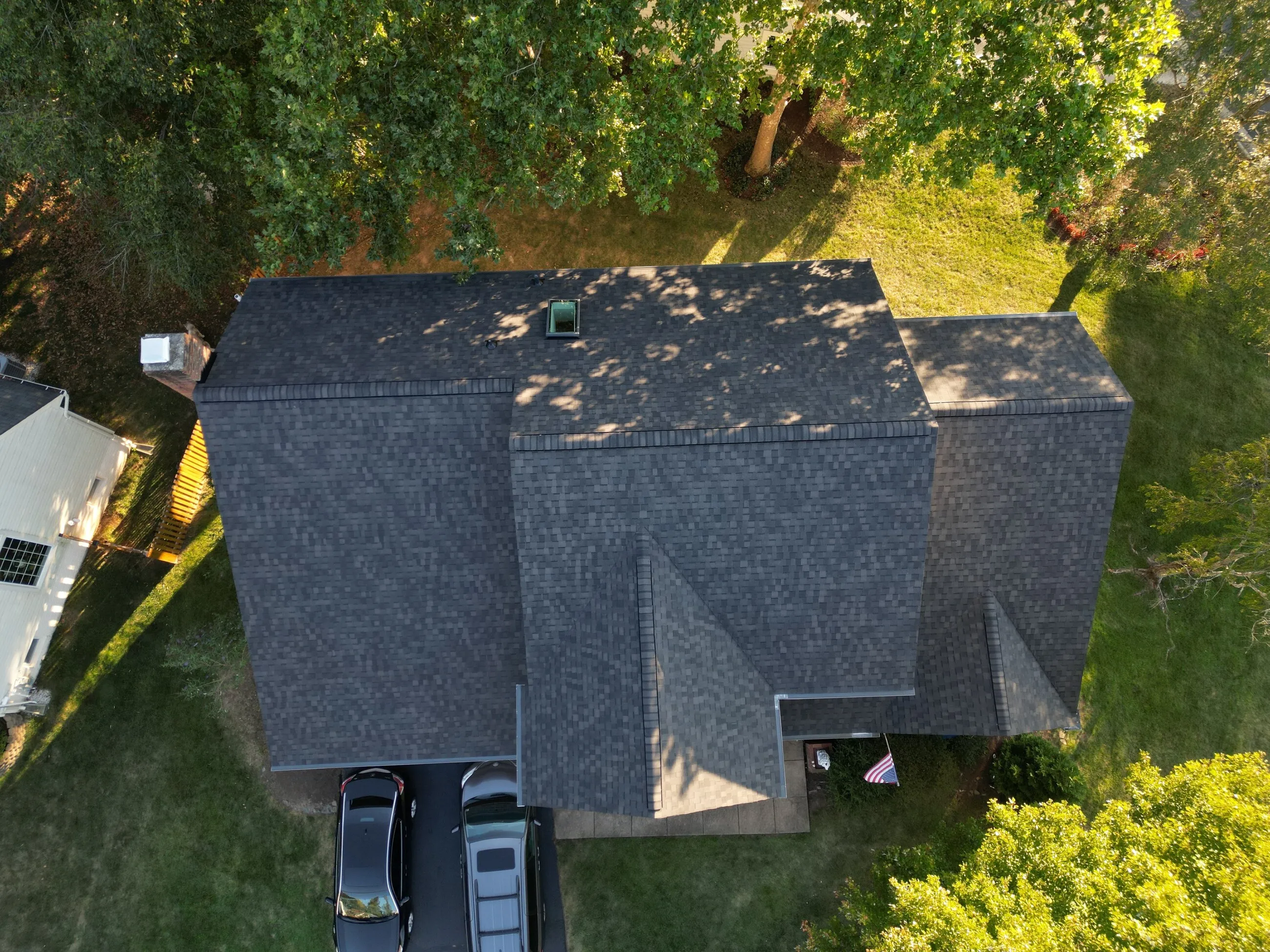 Top-down aerial of a completed architectural shingle roof